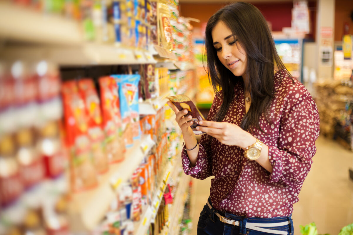 Woman reading food label