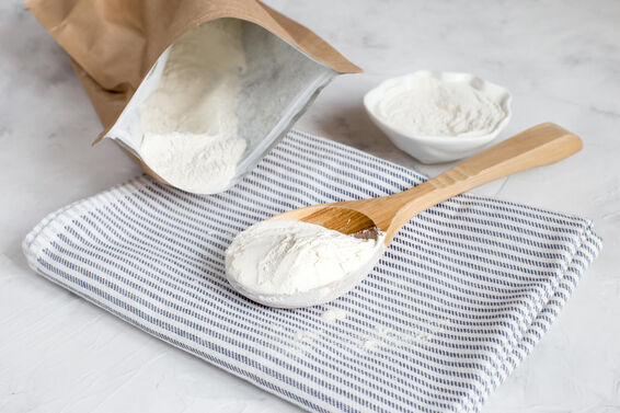 Crumbly xanthan gum in a wooden spoon