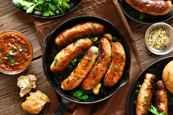 Roasted sausages in frying pan