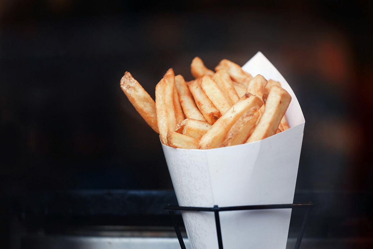 French fries in paper bundle