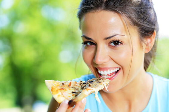 girl eating pizza
