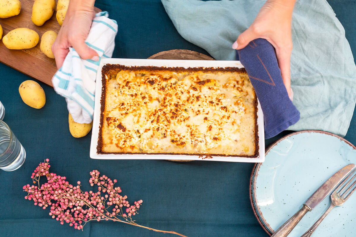 Woman serving turkey casserole