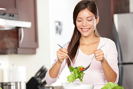 Woman making salad