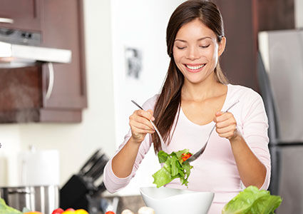 Woman making salad