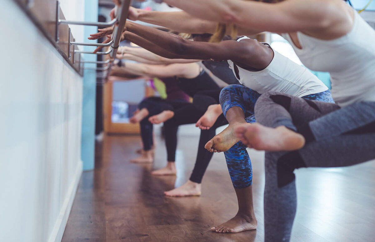 Women doing barre workout together
