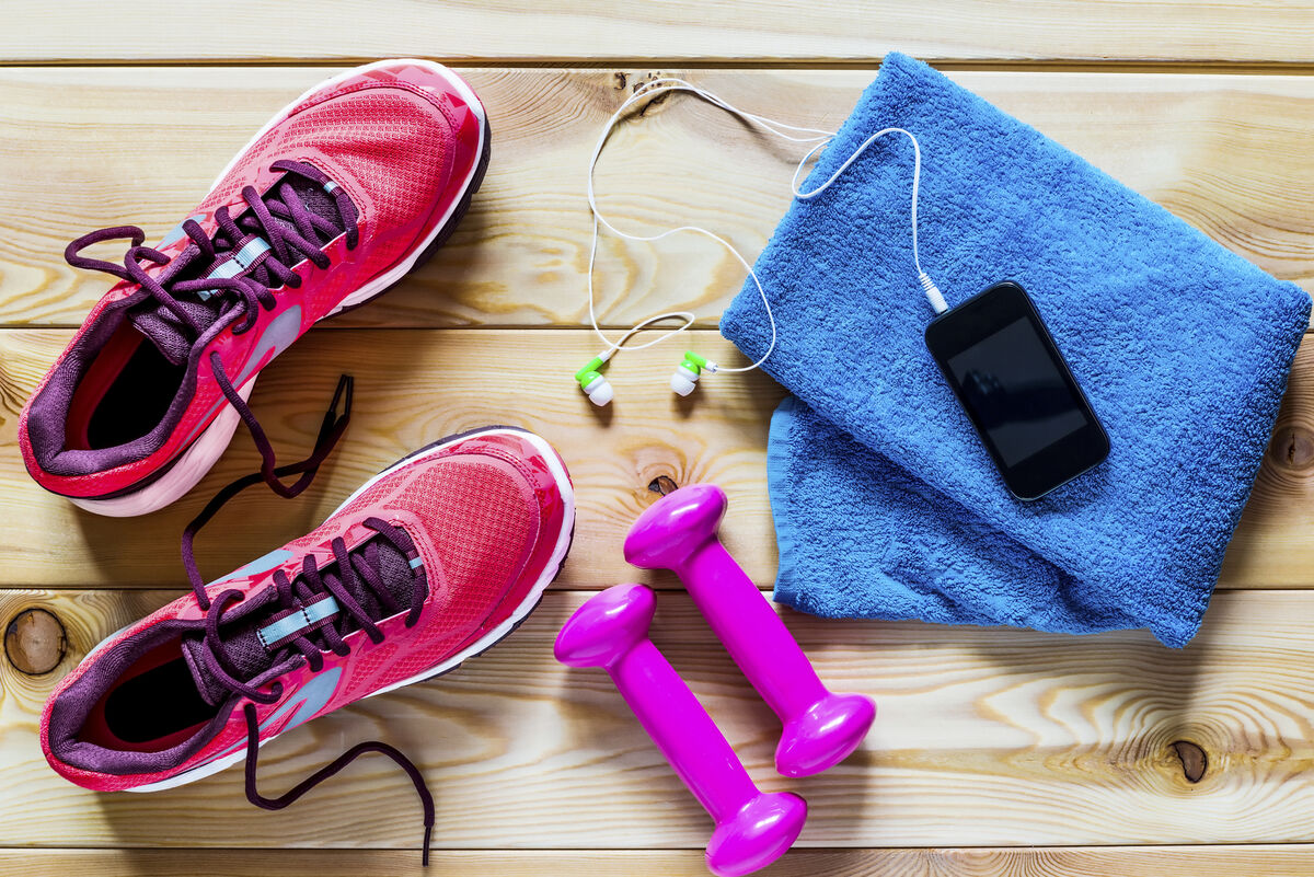 Women's running shoes and dumbbells