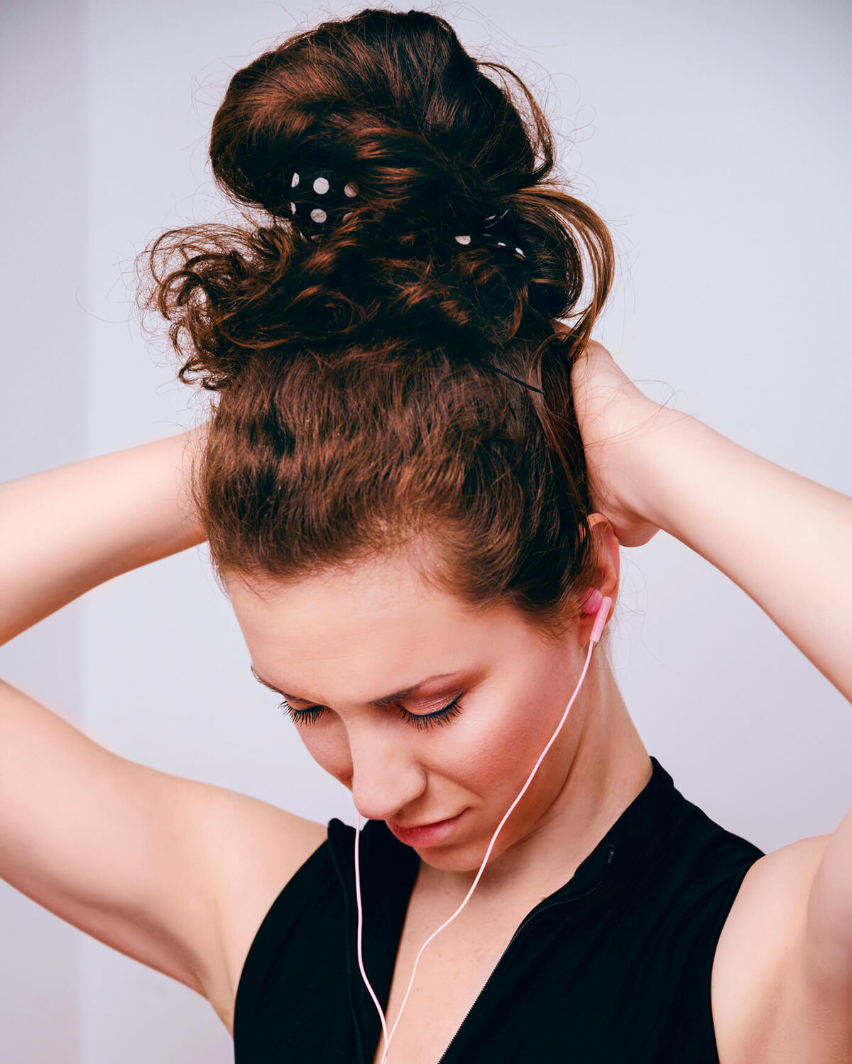 woman is stretching her neck muscles