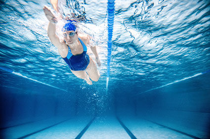 Woman swimming in pool