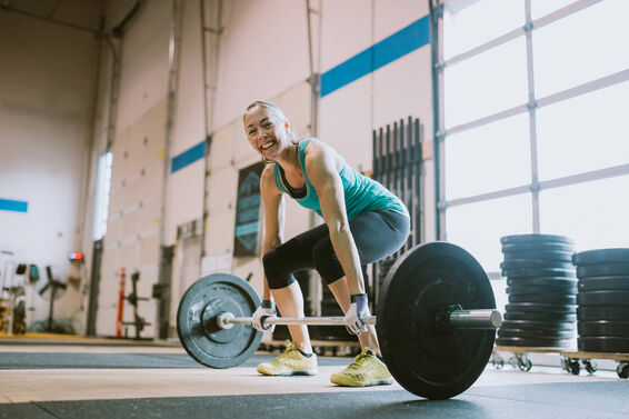 Woman Practicing Deadlifts in Cross Training Gym