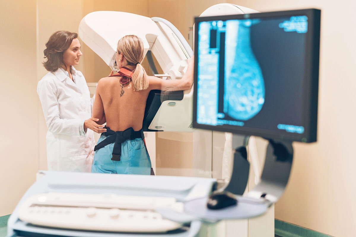 Doctor and patient taking a mammography exam