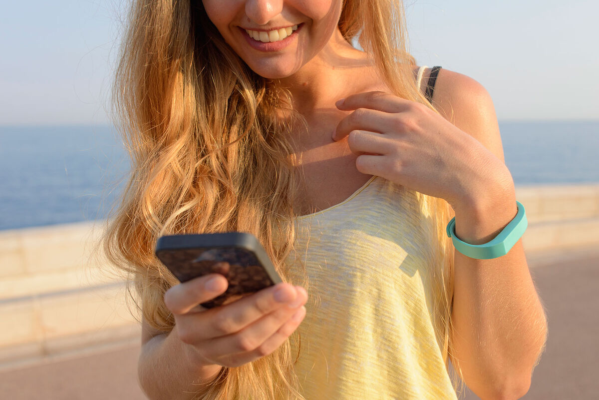 woman tracking walking steps with app
