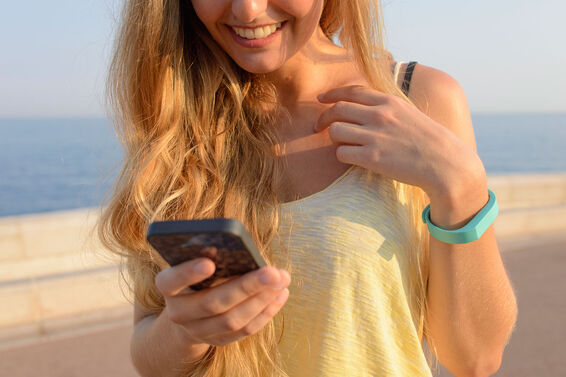 woman tracking walking steps with app
