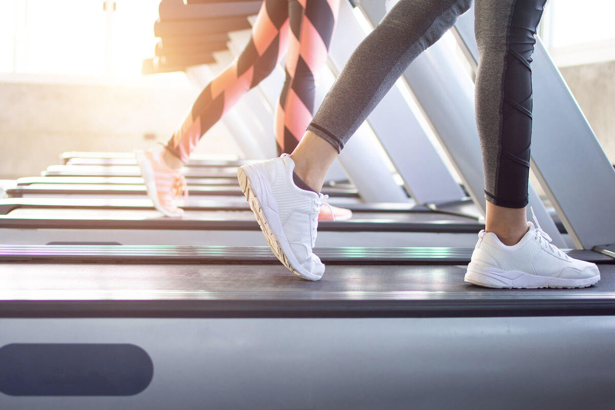 Exercise treadmill cardio running workout at fitness gym