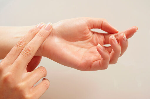 woman checking pulse