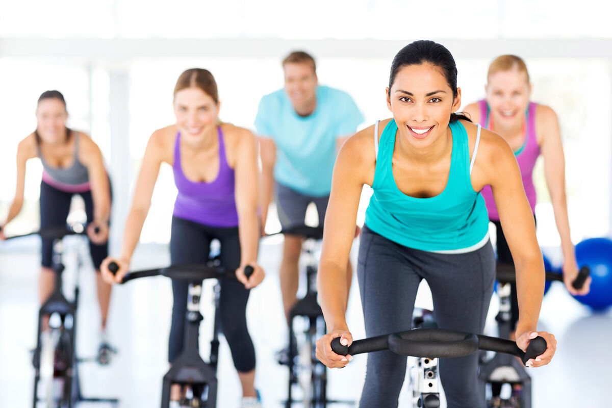 Group of people exercising together at the gym