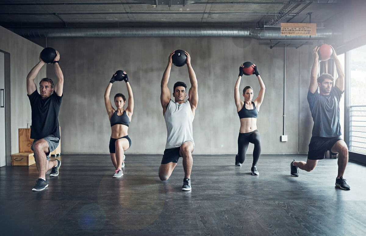 Group working out with medicine ball