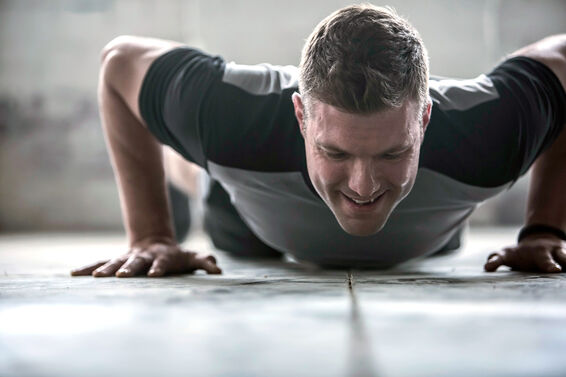 athletic man doing pushups