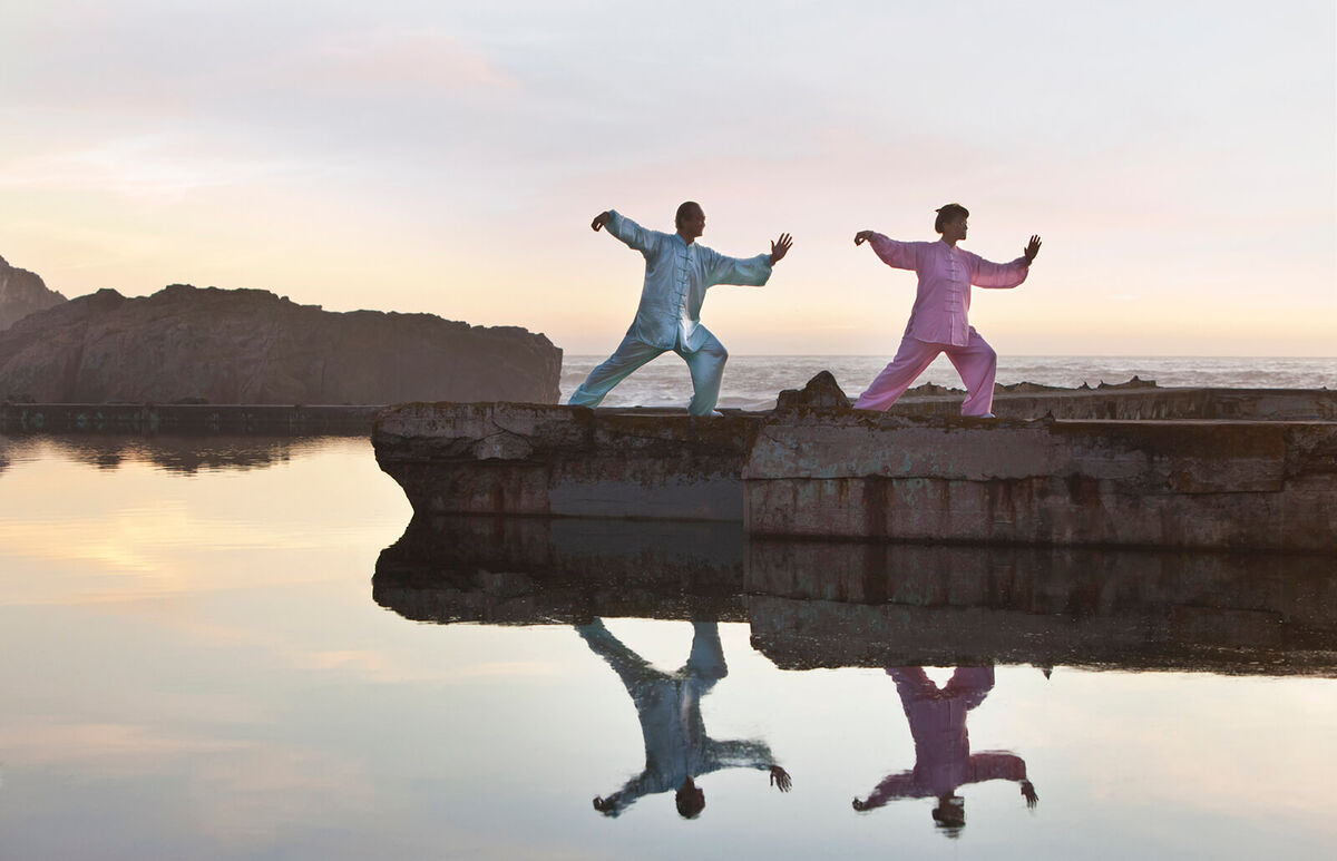 Man and woman practicing Tai Chi