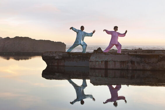 Man and woman practicing Tai Chi