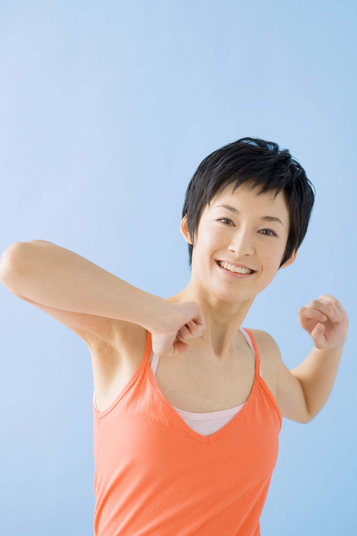 A smiling woman stretching