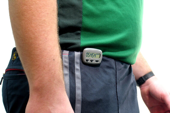 Man waist with a pedometer on pants