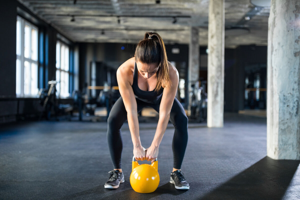 Woman lifting a kettlebell