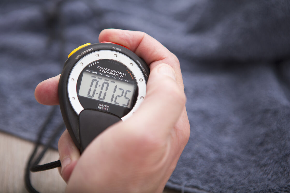 hand holding digital timer