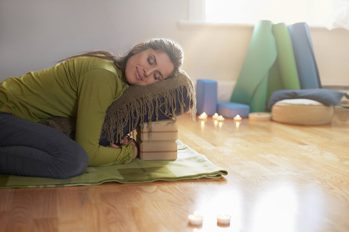 woman doing restorative yoga