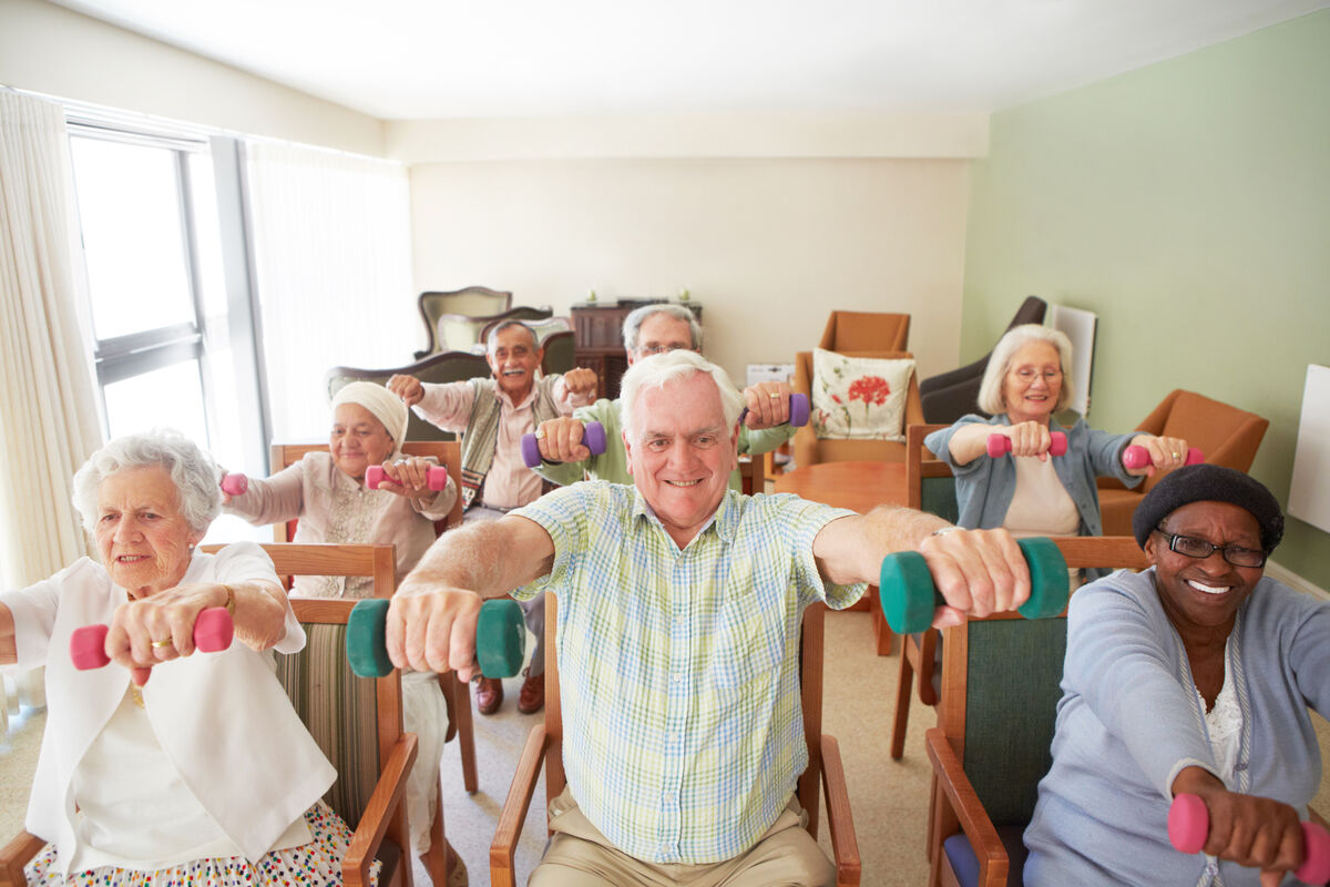 Dumbbell lifts in chairs with seniors