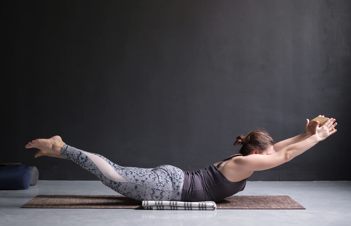 Woman doing superman pose