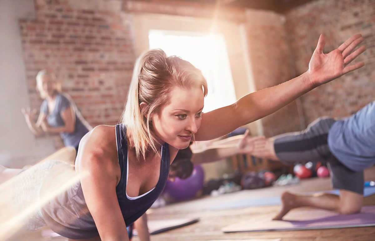 Woman doing bird dog plank