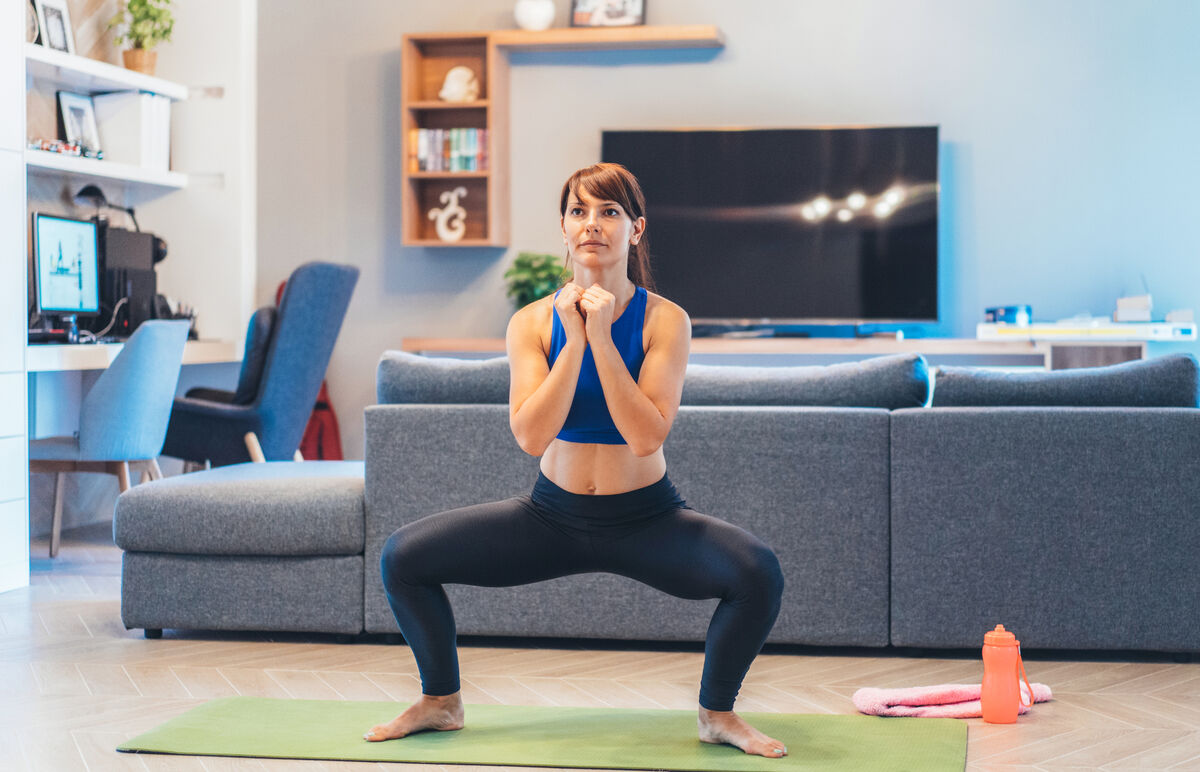Woman performing sumo squat