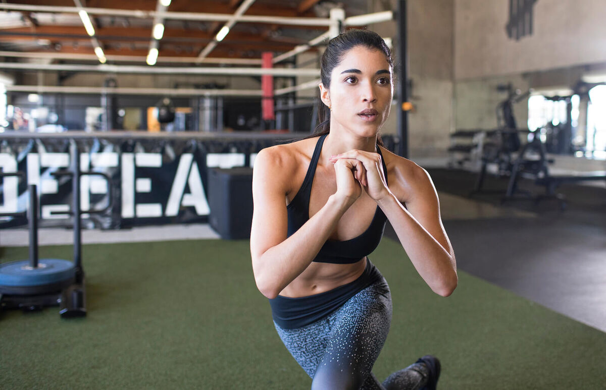 Female athlete exercising at boxing gym