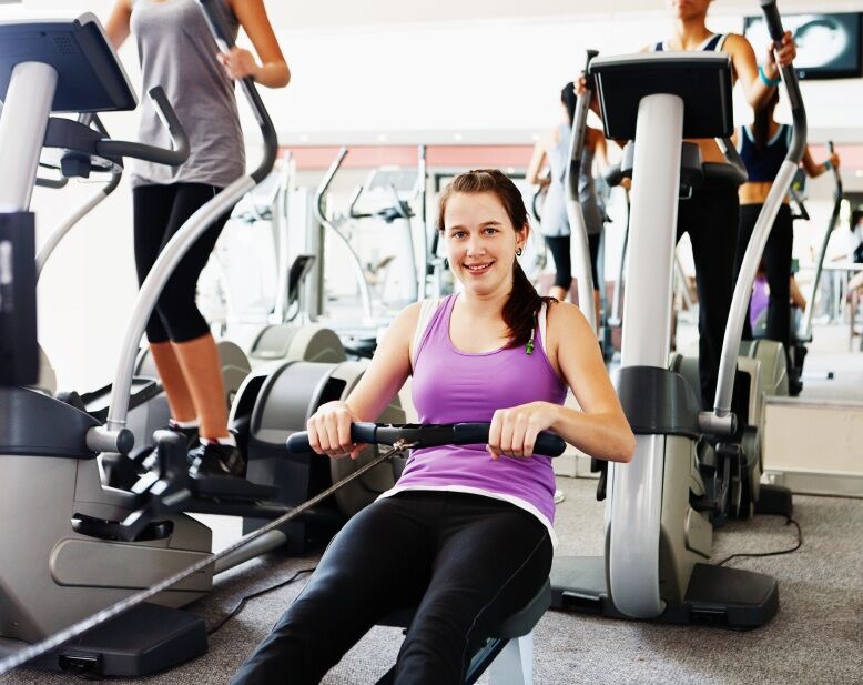 woman using a rowing machine