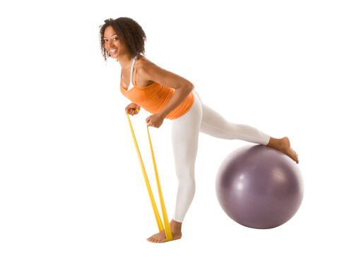 woman exercising with resistance band