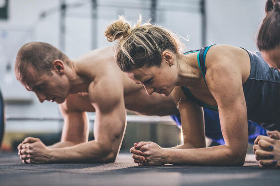 man and woman planking