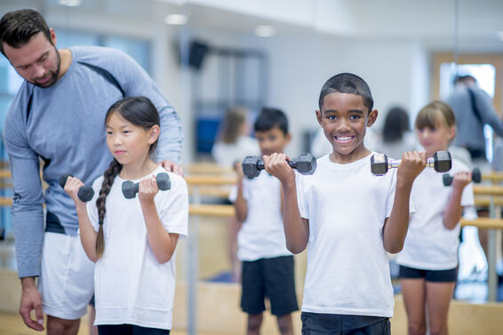 kids using dumbbells