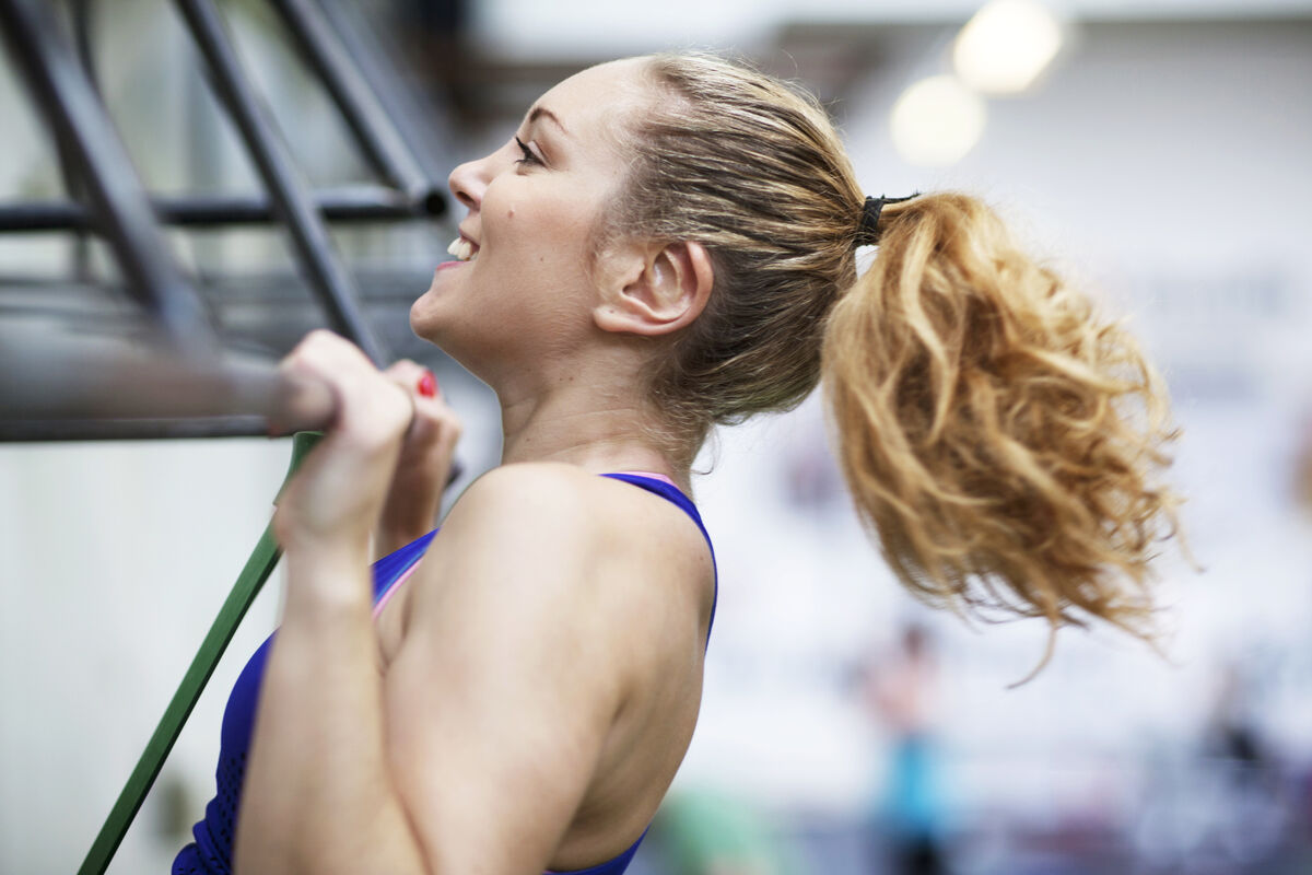 Young woman training in gym center