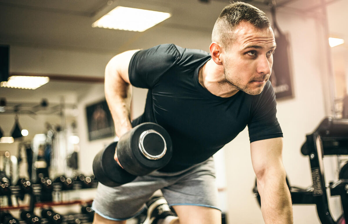 Man Exercising with Arm Weights