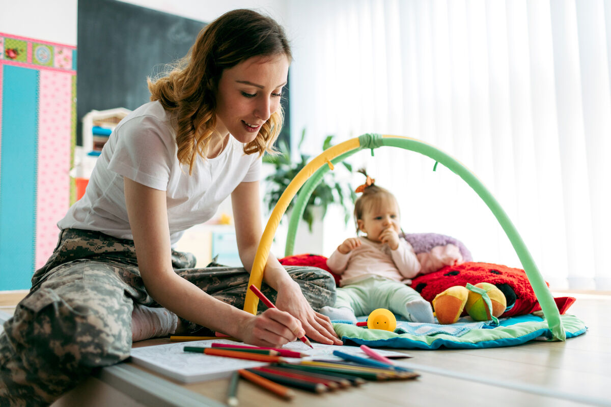 Military mom and her baby at home