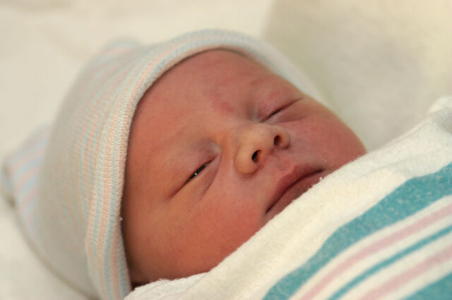 baby in hospital swaddling blanket