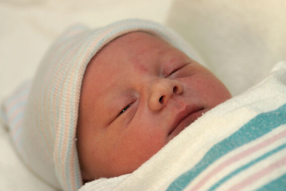 baby in hospital swaddling blanket