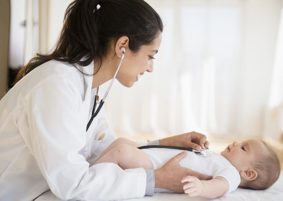 pediatrician examining baby