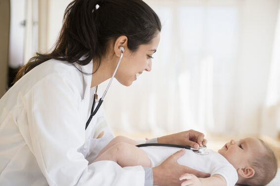 pediatrician examining baby