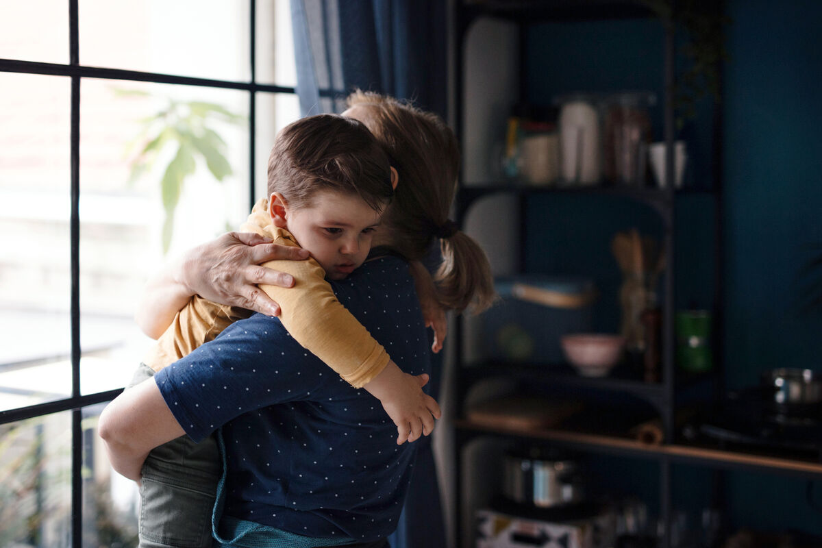 Woman comforting toddler during tantrum