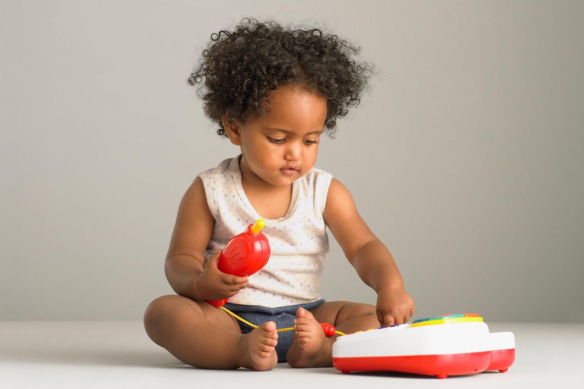 Baby playing with toy phone