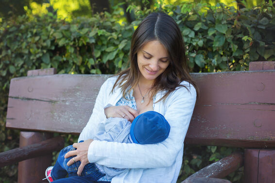 mother breastfeeding newborn baby
