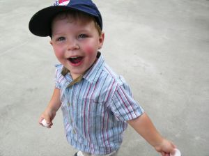 Image of a toddler boy wearing a baseball cap