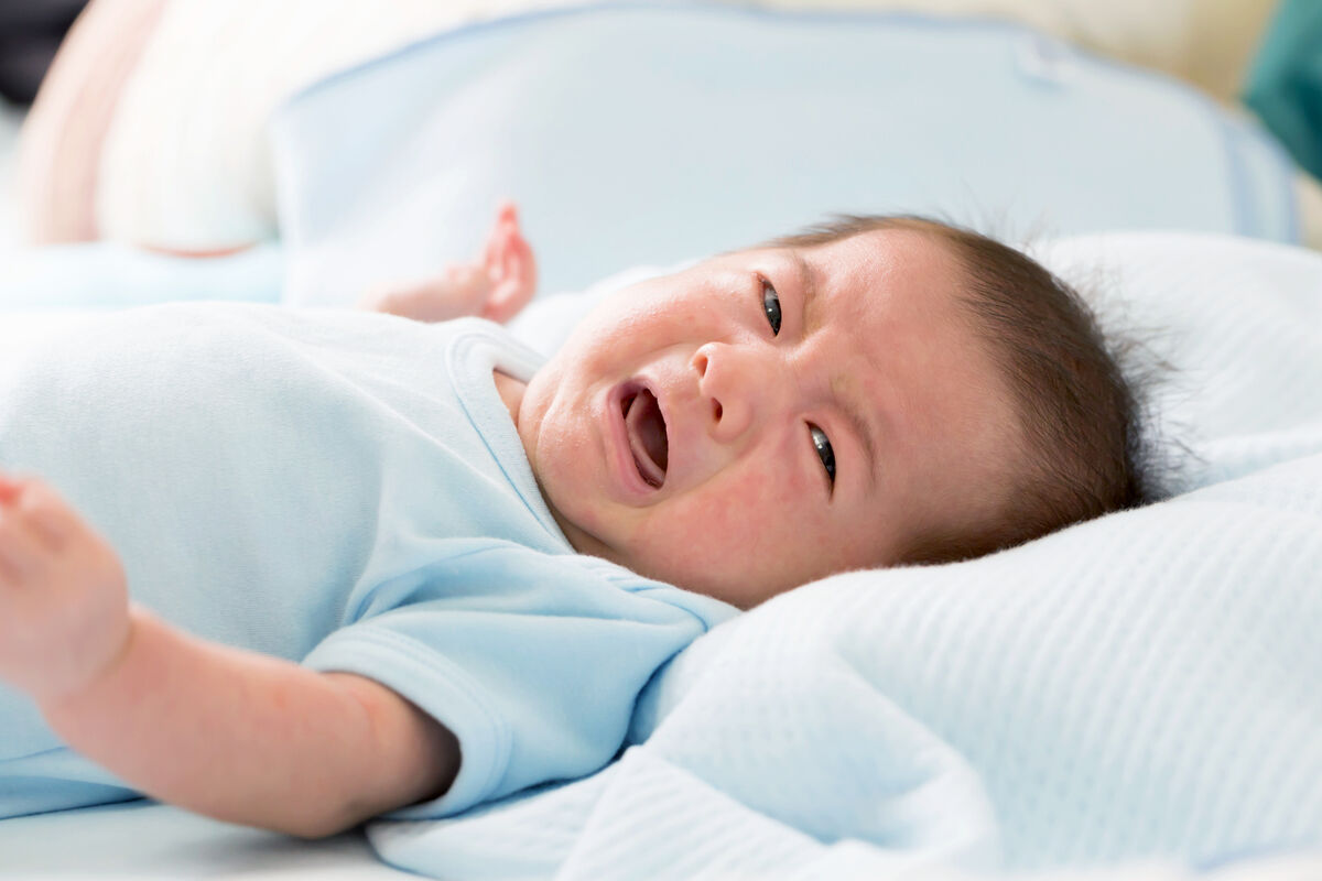 Baby crying with colic symptoms