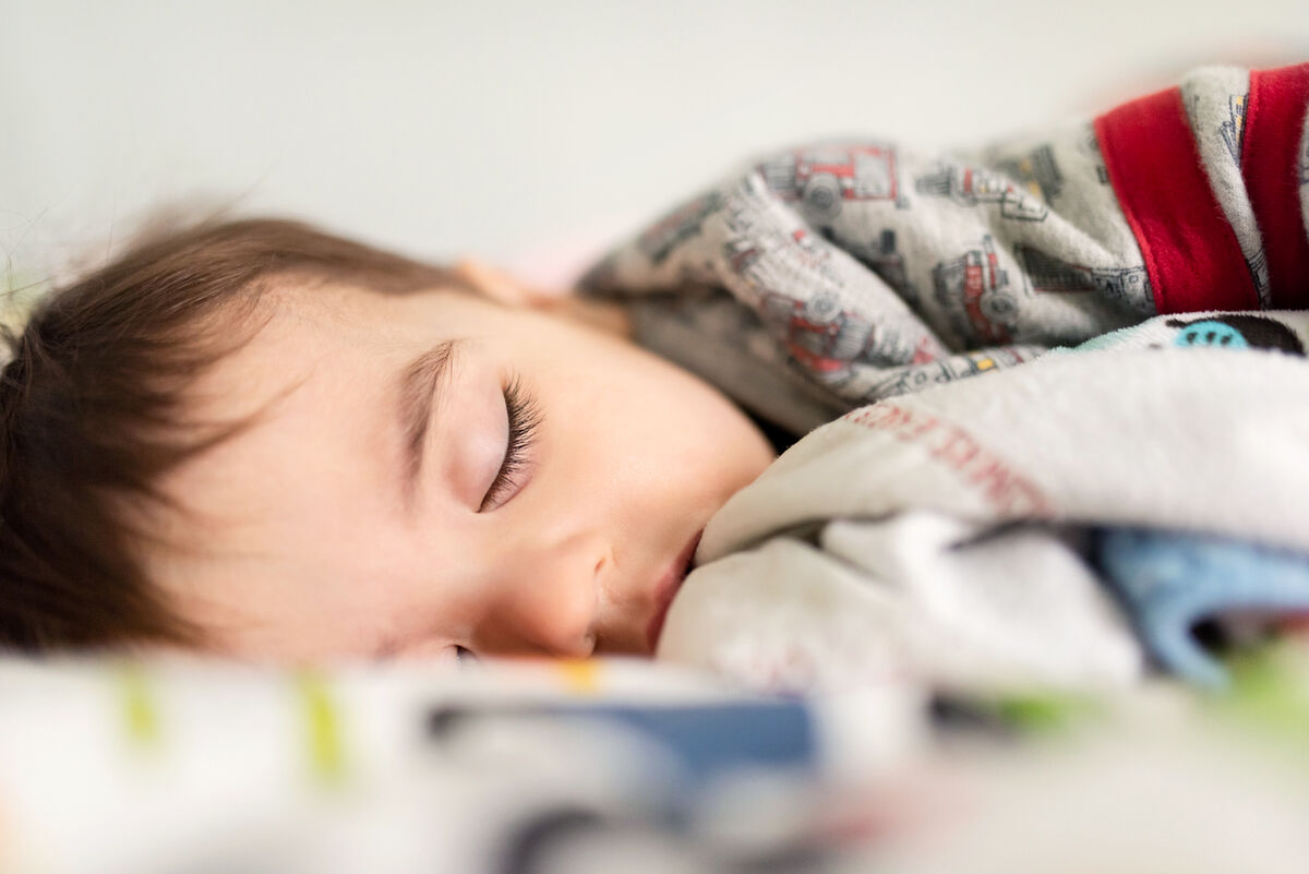 Toddler sleeping recovering from the cold and flu season